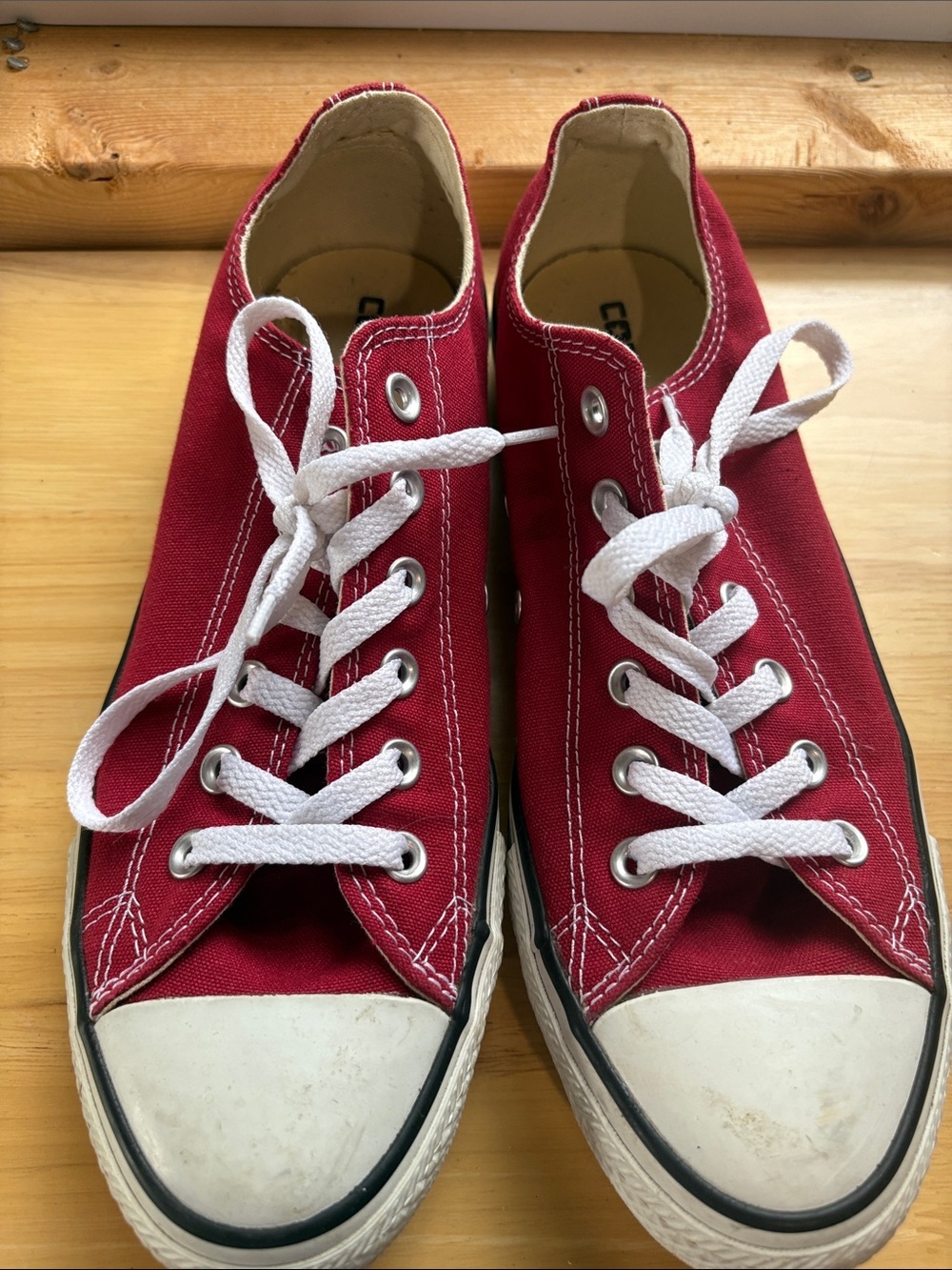 Red Low-Top Converse Sneakers with White Laces
